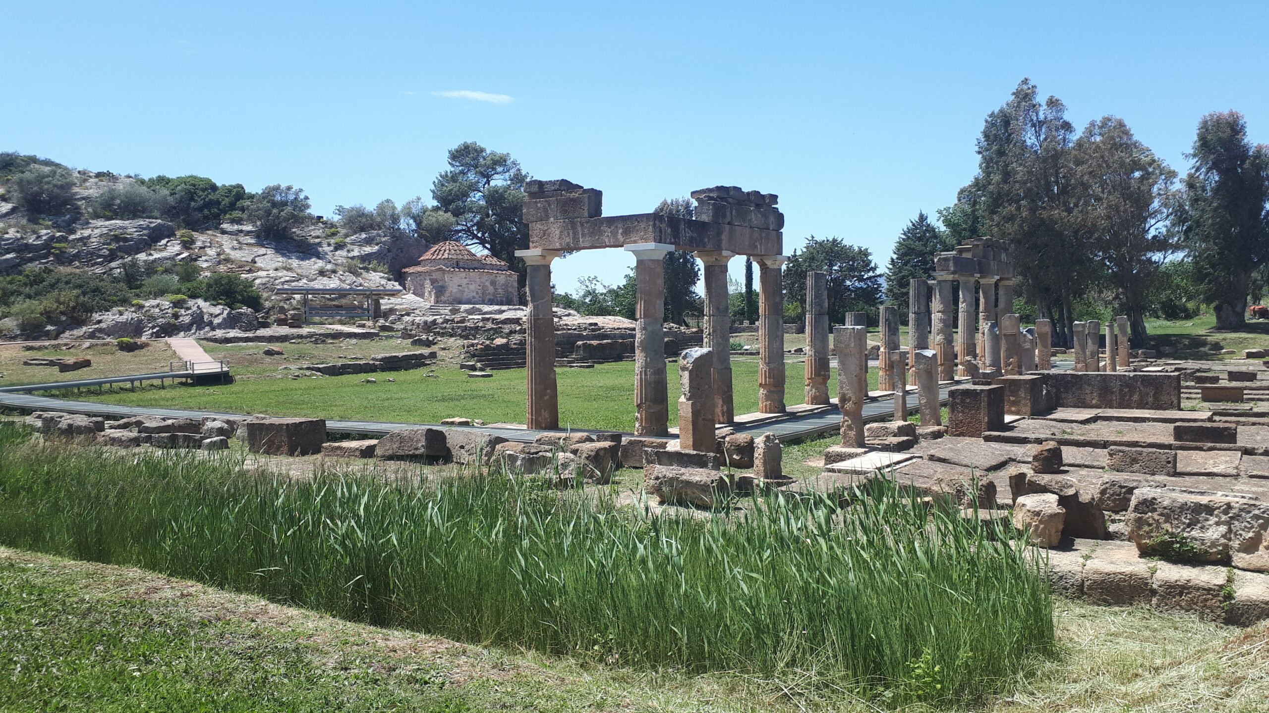 The colonnade and the rooms of the stoa with the Temple of Artemis in the background