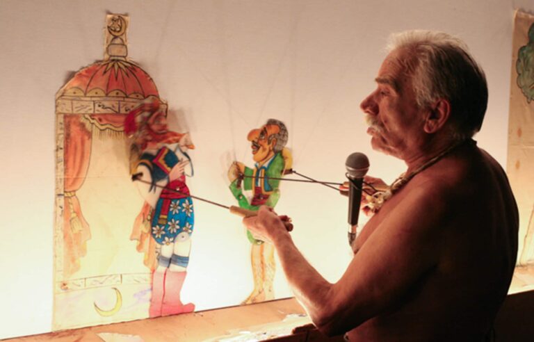 The Patras-born shadow puppeteer Giannis Mourelatos (Giannaros) during the Fourth Greek Shadow Theatre Competition, Patras, 2008 (Archive of the Cultural Organization of the Municipality of Patras)