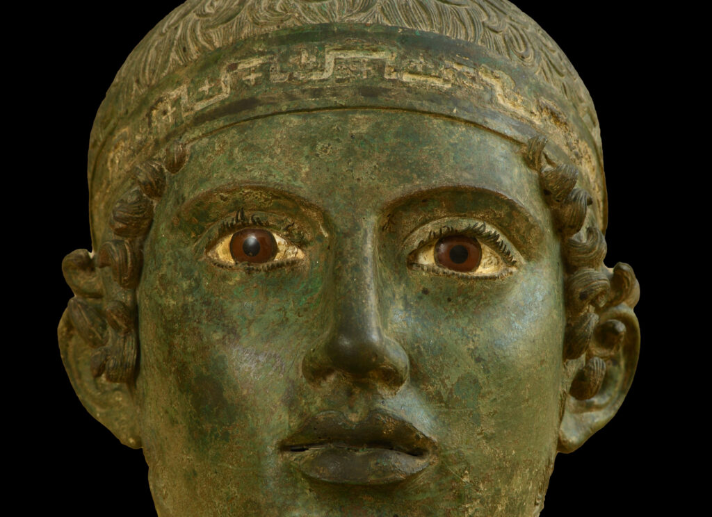 A close-up of the Charioteer of Delphi